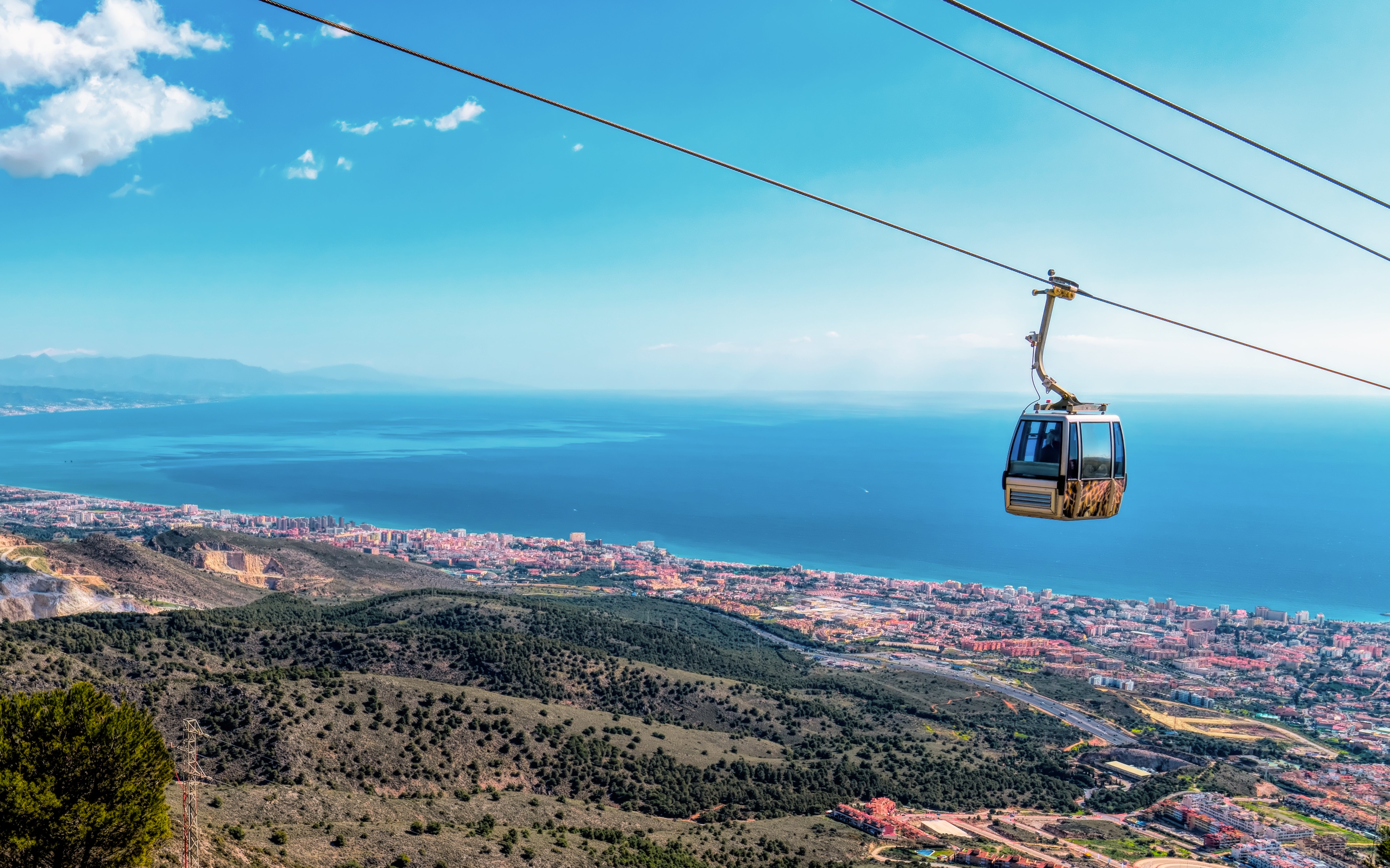 Cable car over Costa del Sol coast, Benalmadena, Spain, viewed from Monte Calamorro.