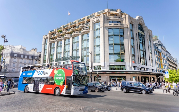 Paris hop-on hop-off bus passing Samaritaine department store.
