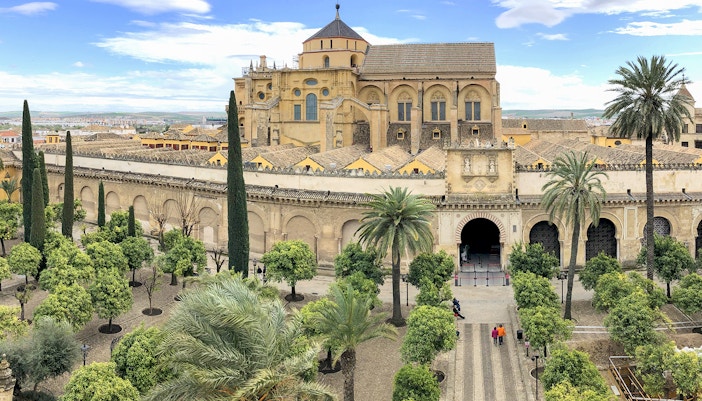 Córdoba Cathedral-Mosque entrance with intricate arches and historic architecture.