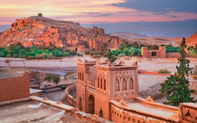 Ait Ben-Haddou kasbah with ancient clay buildings at sunset, Morocco.
