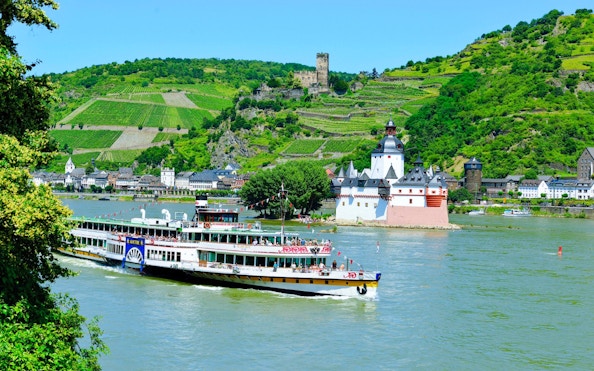 Paddle steamer Goethe passing Pfalzgrafenstein Castle on the Rhine River, Germany.