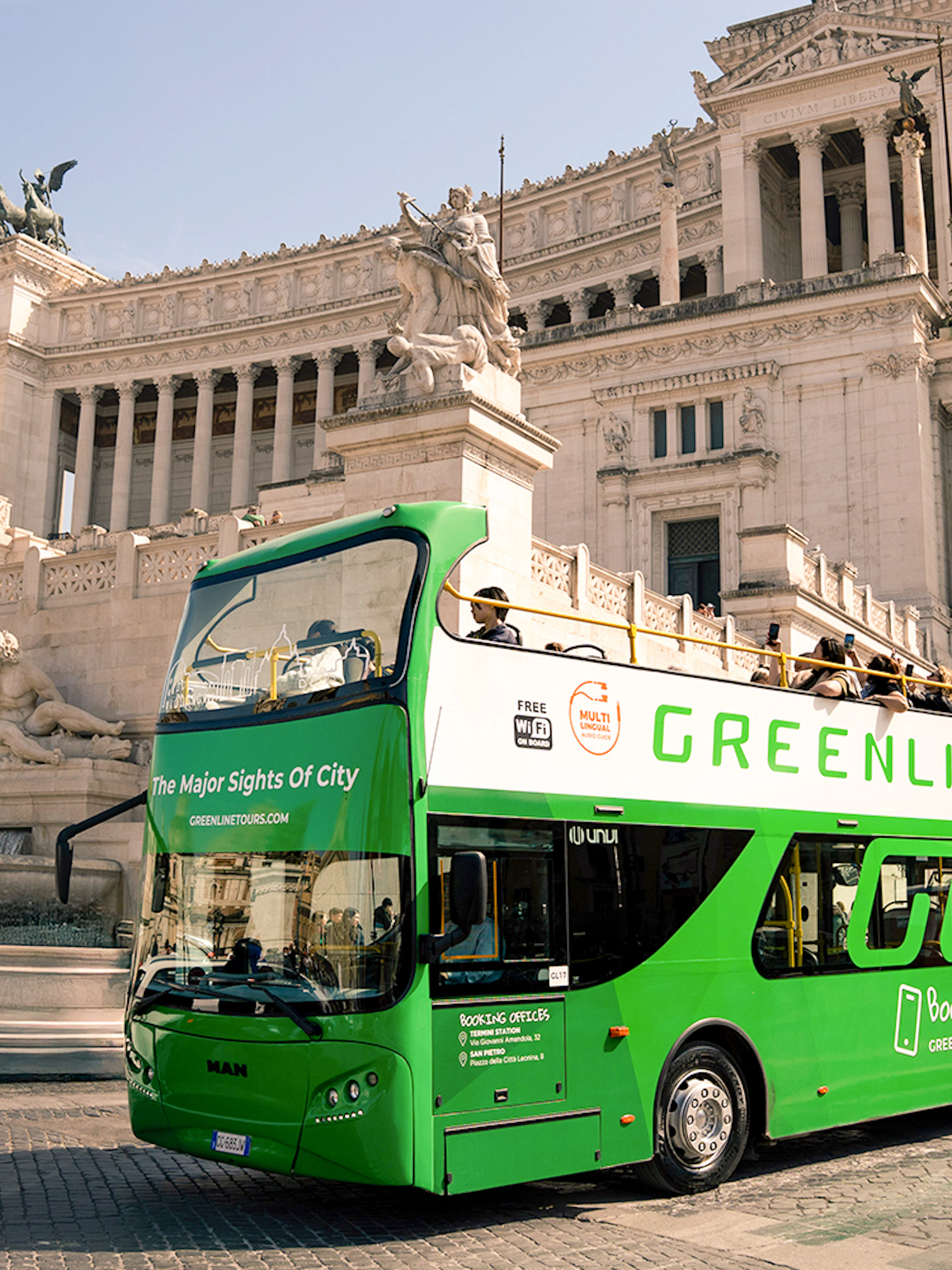 Green Line hop-on hop-off bus in front of the Altare della Patria, Rome.