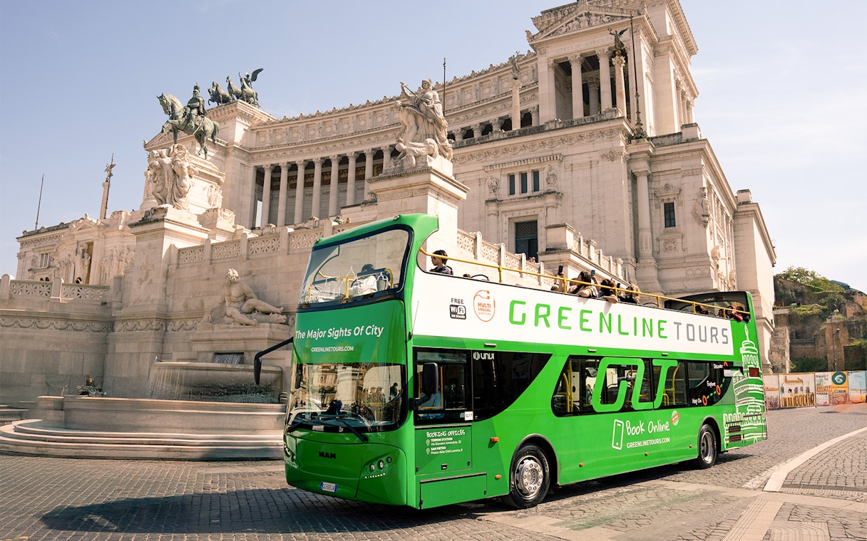 Green Line hop-on hop-off bus in front of the Altare della Patria, Rome.