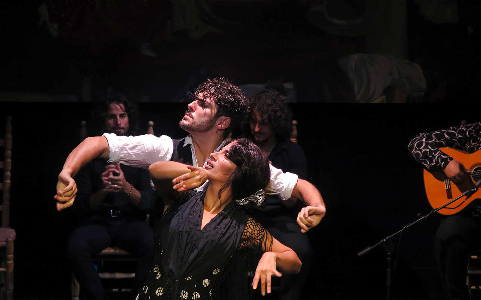 Flamenco dancers performing at Triana Theater in Seville.