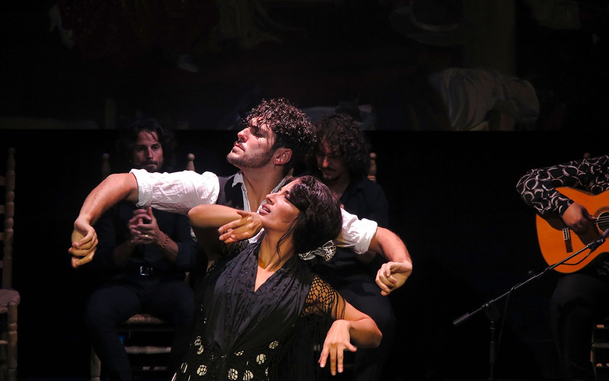 Flamenco dancers performing at Triana Theater in Seville.
