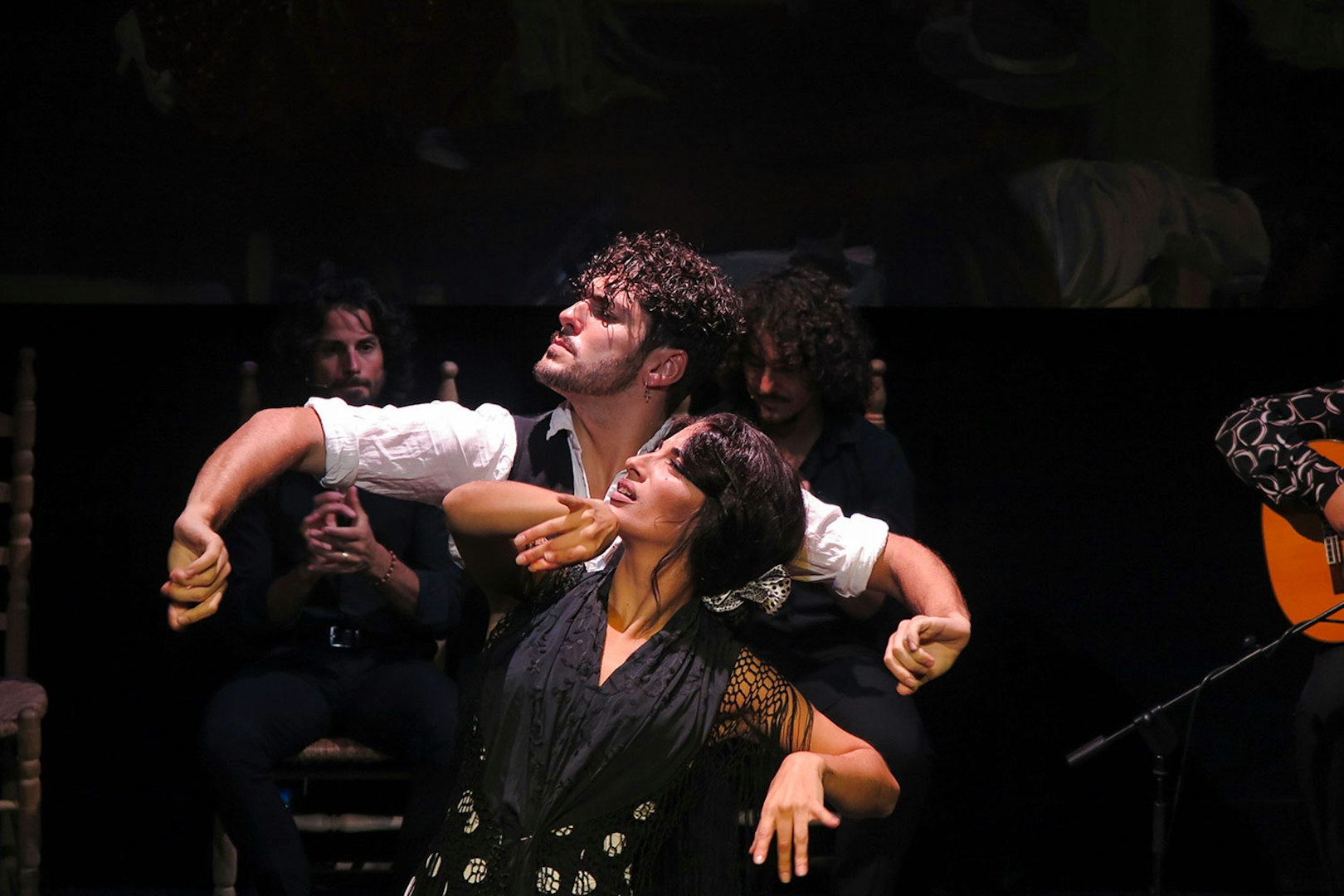 Flamenco dancers performing at Triana Theater in Seville.