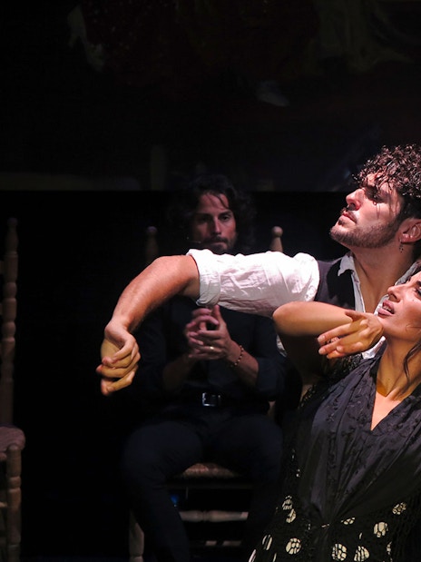 Flamenco dancers performing at Triana Theater in Seville.