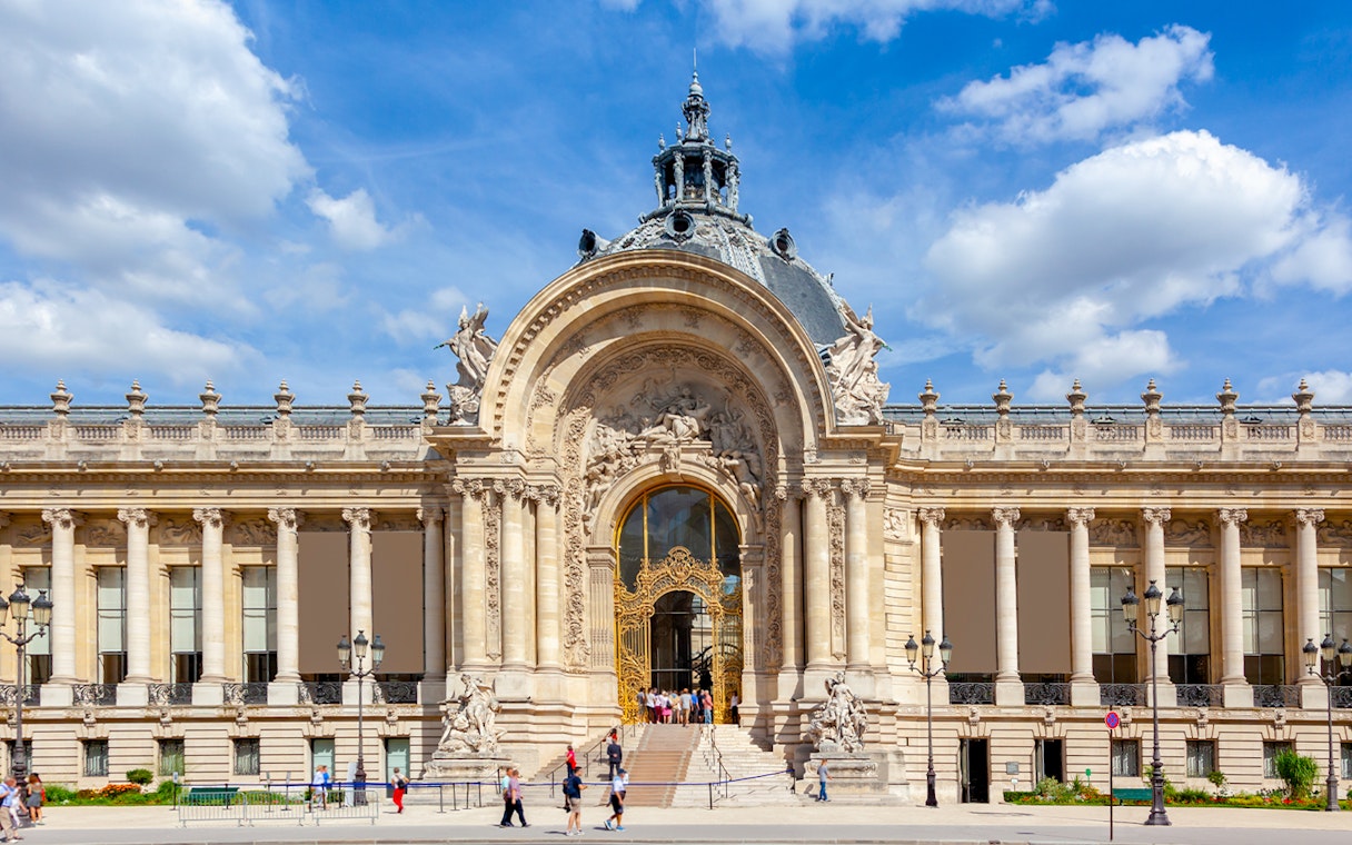 Ornate facade of Petit Palais in Paris with intricate architectural details.