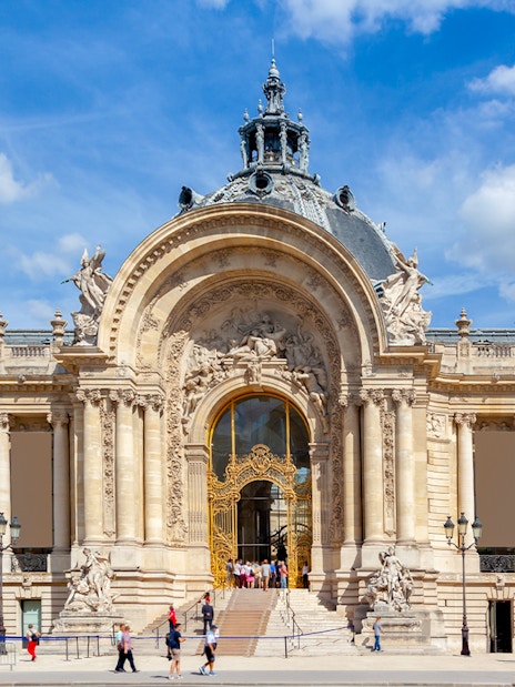 Ornate facade of Petit Palais in Paris with intricate architectural details.