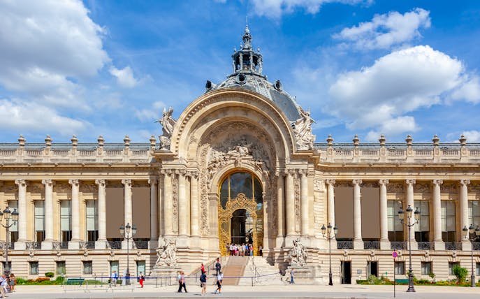 Ornate facade of Petit Palais in Paris with intricate architectural details.