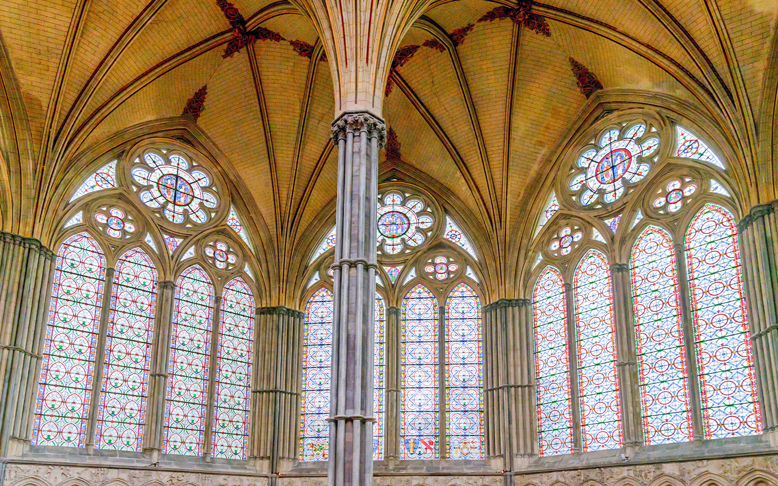 Stained glass windows and vaulted ceiling in the Chapter House, Salisbury Cathedral.