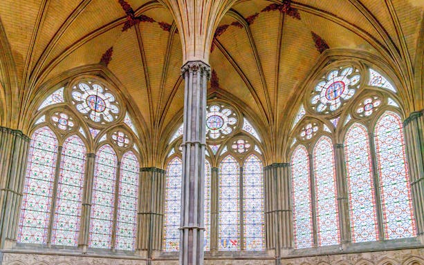 Stained glass windows and vaulted ceiling in the Chapter House, Salisbury Cathedral.