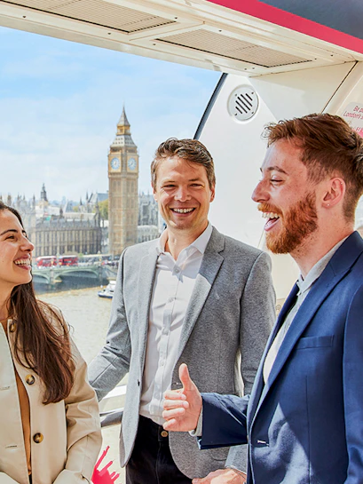 Group enjoying the view of Big Ben and the Thames from a London Eye capsule.