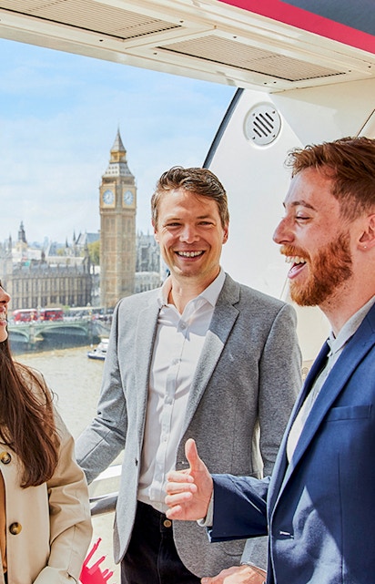Group enjoying the view of Big Ben and the Thames from a London Eye capsule.