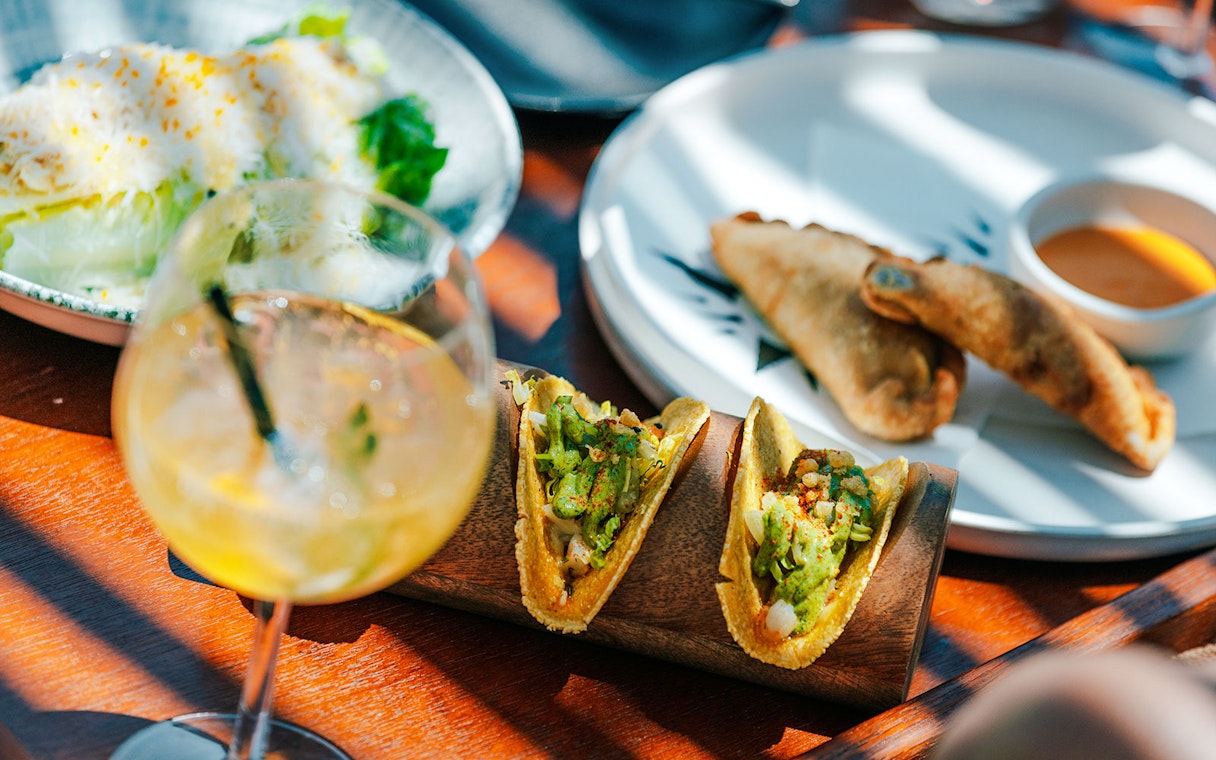 Tacos and empanadas served at Terra Solis dining experience.