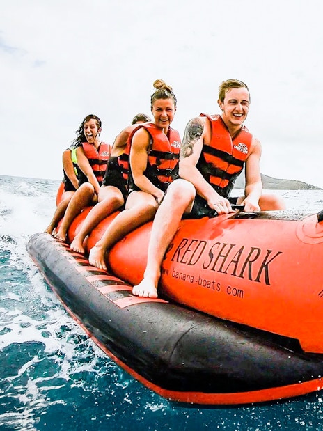 Tourists riding a banana boat in the Whitsundays.