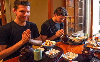 Guests enjoying traditional Japanese meal during Tokyo Samurai Experience.