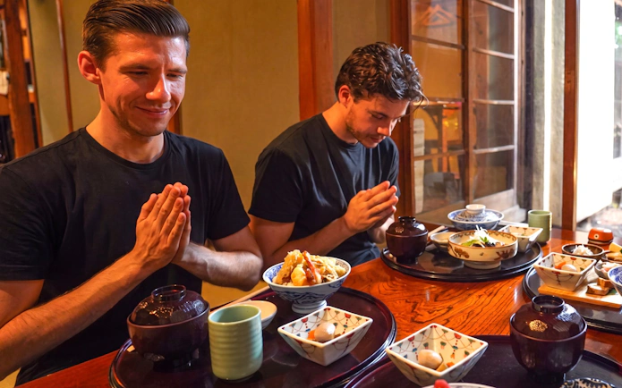 Guests enjoying traditional Japanese meal during Tokyo Samurai Experience.
