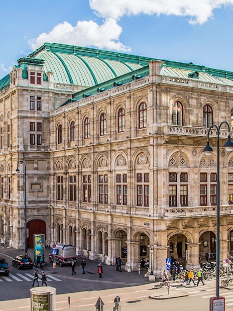 Vienna State Opera exterior with green roof and ornate facade, Austria.