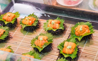 Sea urchin sushi on shiso leaves at Tsukiji Market, Tokyo.