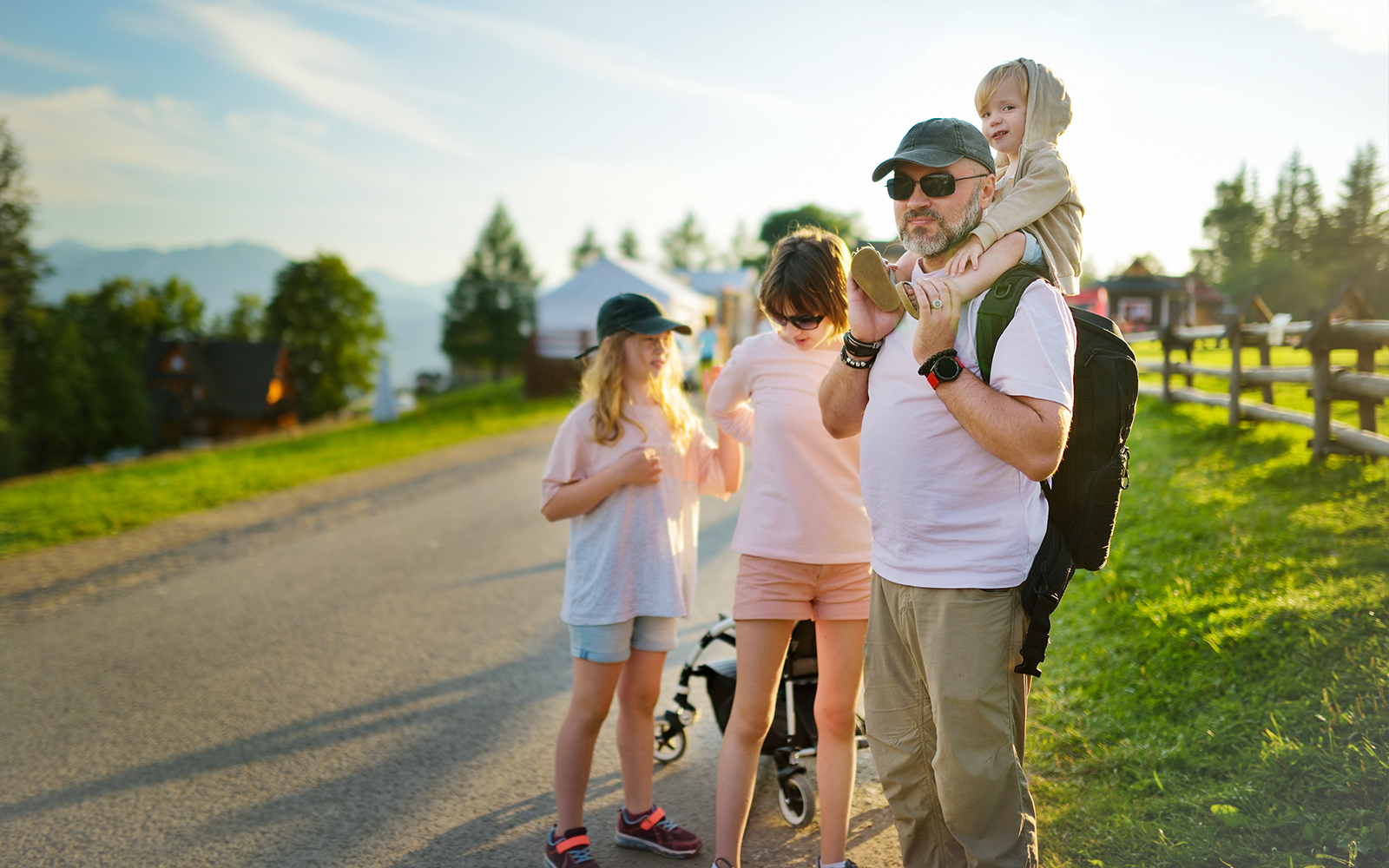 Family enjoying a walk on Gubałówka Hill, Zakopane, with scenic mountain views.