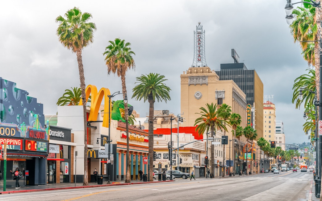 TMZ tour bus on Hollywood Boulevard near El Capitan Theatre, Los Angeles.