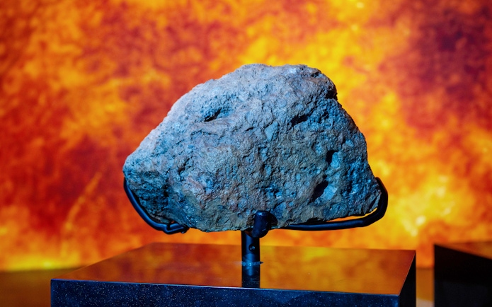 Ash Shaqqah 002 Meteorite with fusion crust at National History Museum, Abu Dhabi.