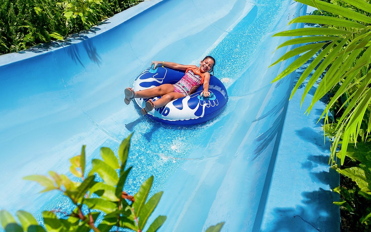 Visitors enjoying water slide at Aqualand Maspalomas.