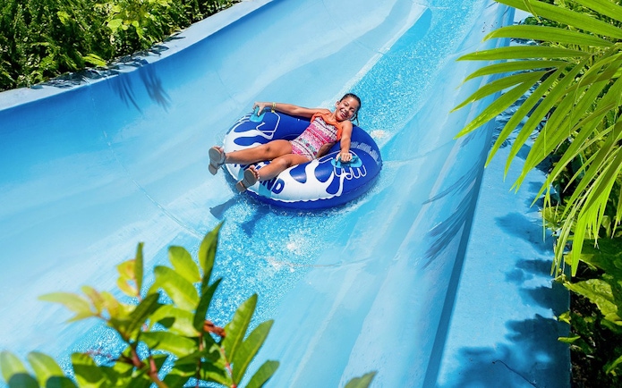 Visitors enjoying water slide at Aqualand Maspalomas.