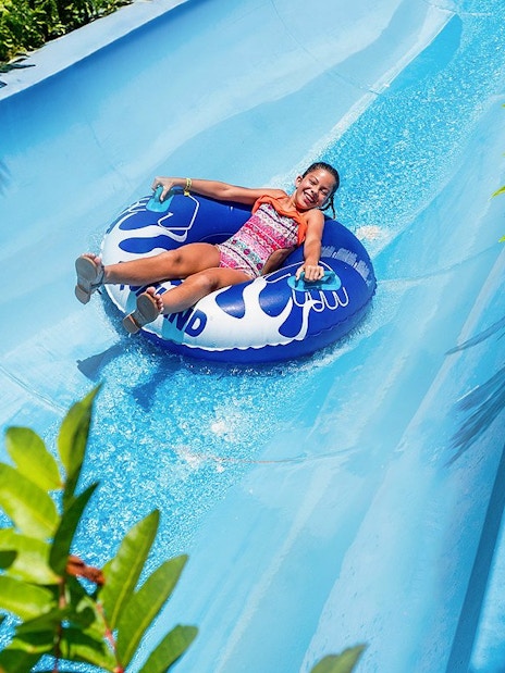 Visitors enjoying water slide at Aqualand Maspalomas.