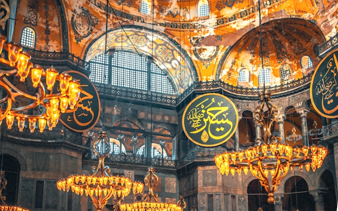 Hagia Sophia interior with chandeliers and Arabic calligraphy, Istanbul.