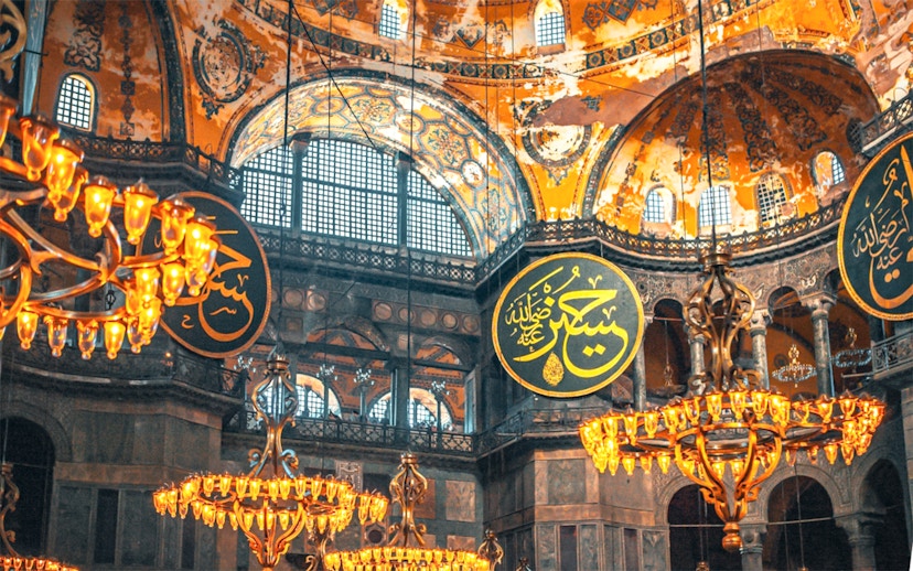 Hagia Sophia interior with chandeliers and Arabic calligraphy, Istanbul.