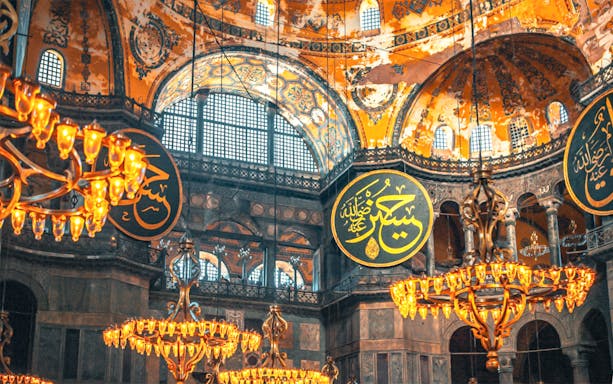 Hagia Sophia interior with chandeliers and Arabic calligraphy, Istanbul.