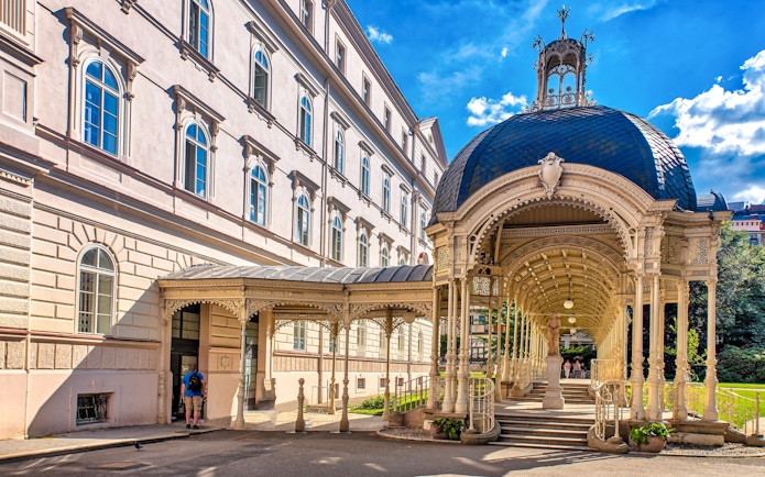 Park Colonnade in Karlovy Vary with ornate architecture and a domed roof.