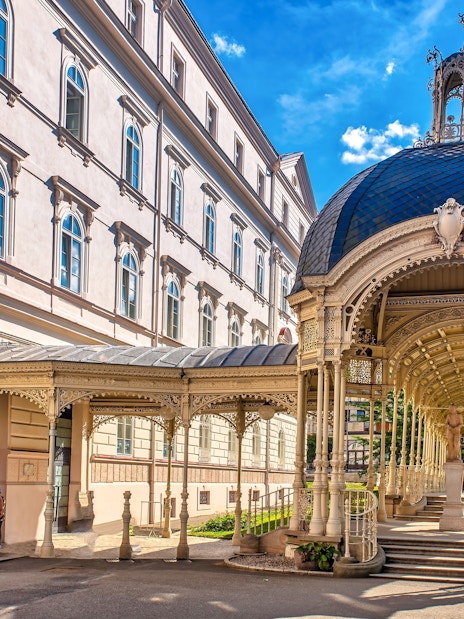 Park Colonnade in Karlovy Vary with ornate architecture and a domed roof.