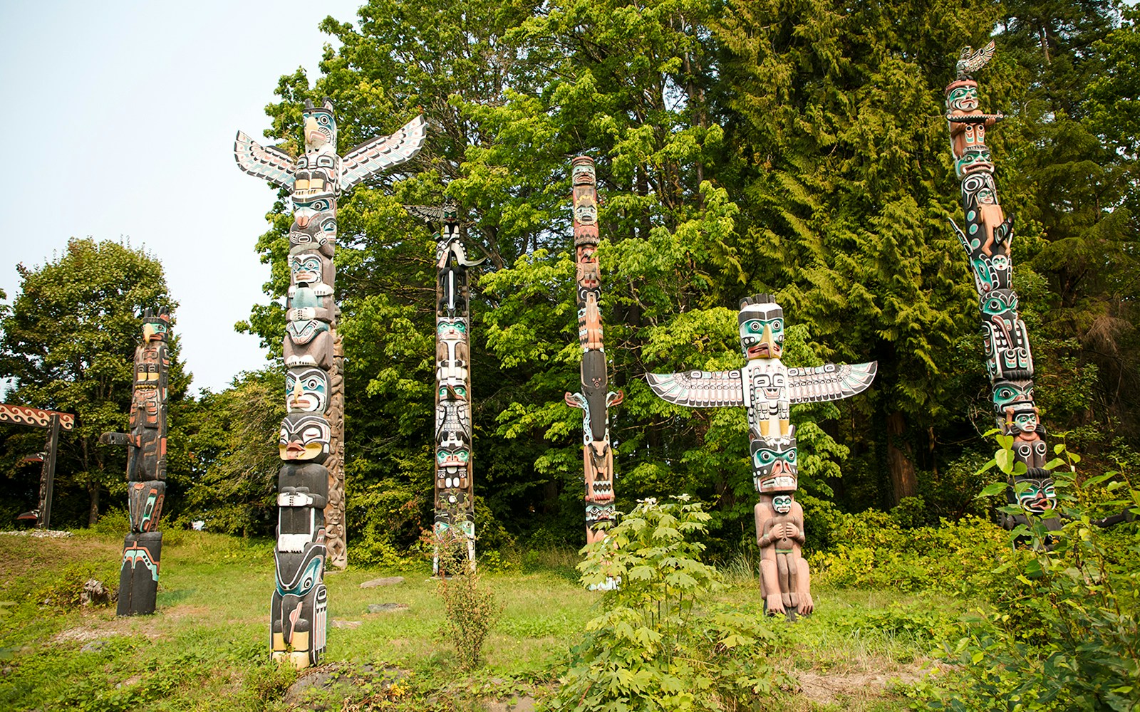 Totem poles surrounded by trees at Capilano Suspension Bridge, Vancouver.