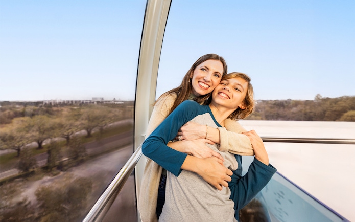 Couple enjoying a ride on the ICON Park observation wheel in Orlando.