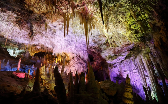 Stalactites and stalagmites in illuminated Hams Caves, Mallorca.