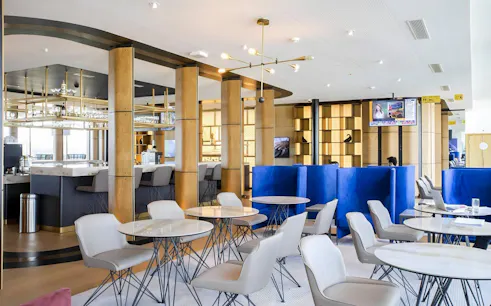 Primeclass Lounge seating area at Zurich Airport Terminal E with modern decor.