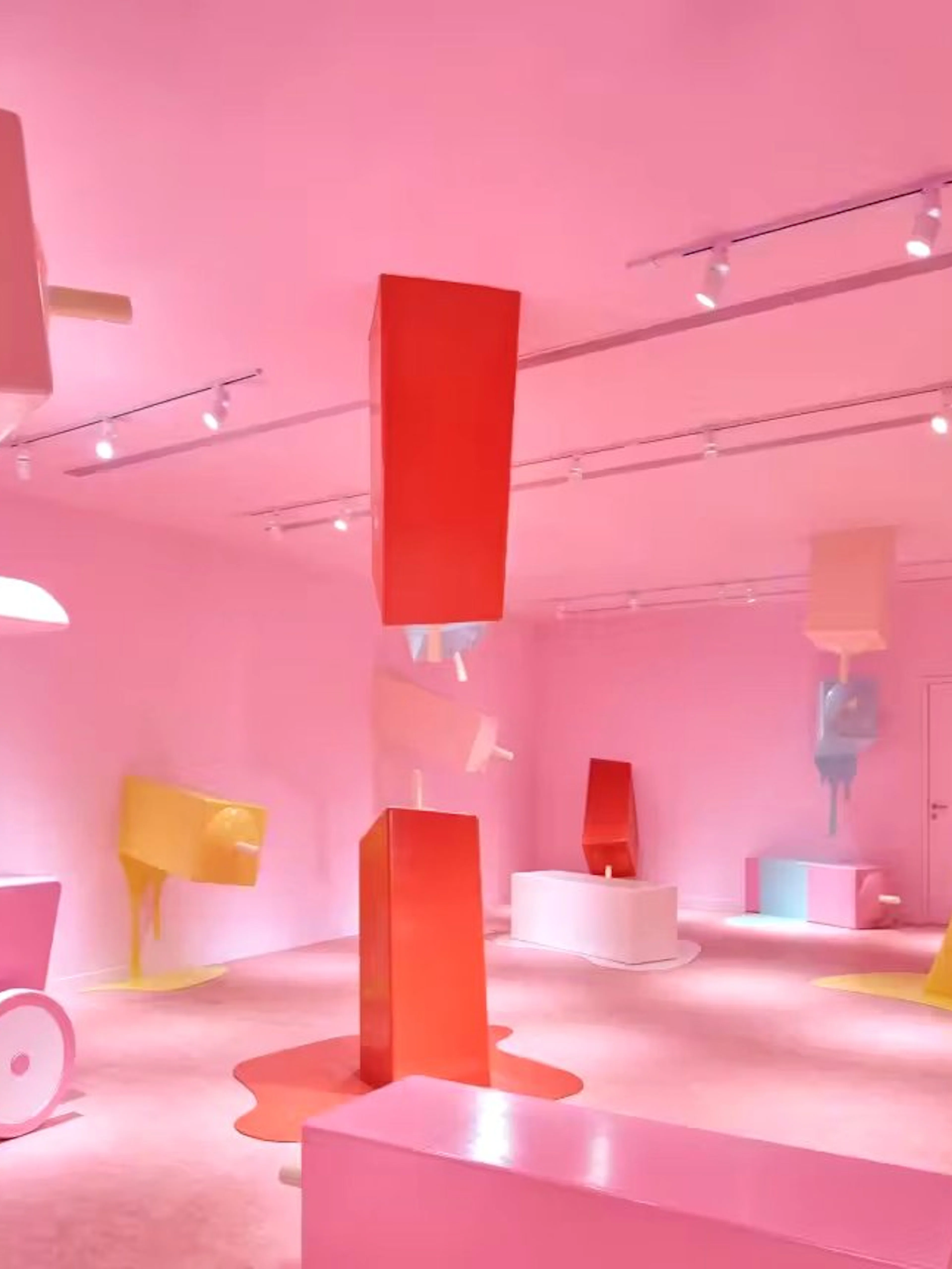 Interactive pink room with oversized ice cream bars at Museum of Ice Cream Singapore.