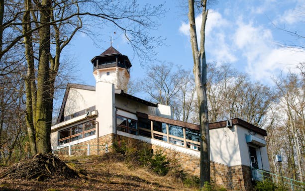 Lookout tower Diana surrounded by trees in Karlovy Vary.