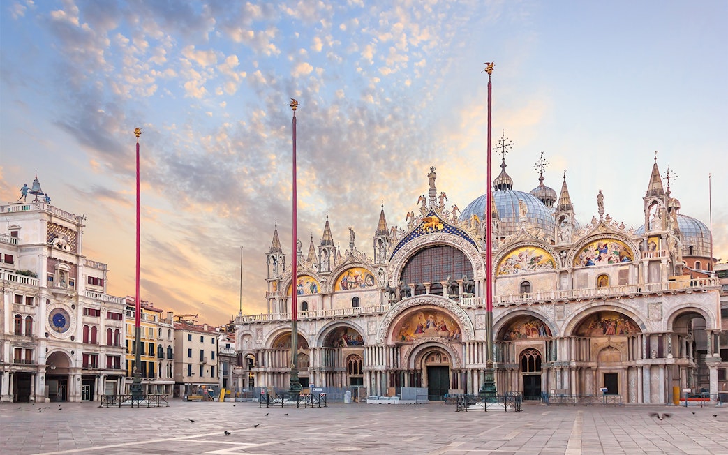 St. Mark's Basilica facade with ornate architecture and detailed mosaics in Venice.