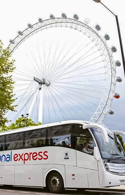 National Express bus in front of the London Eye, England.