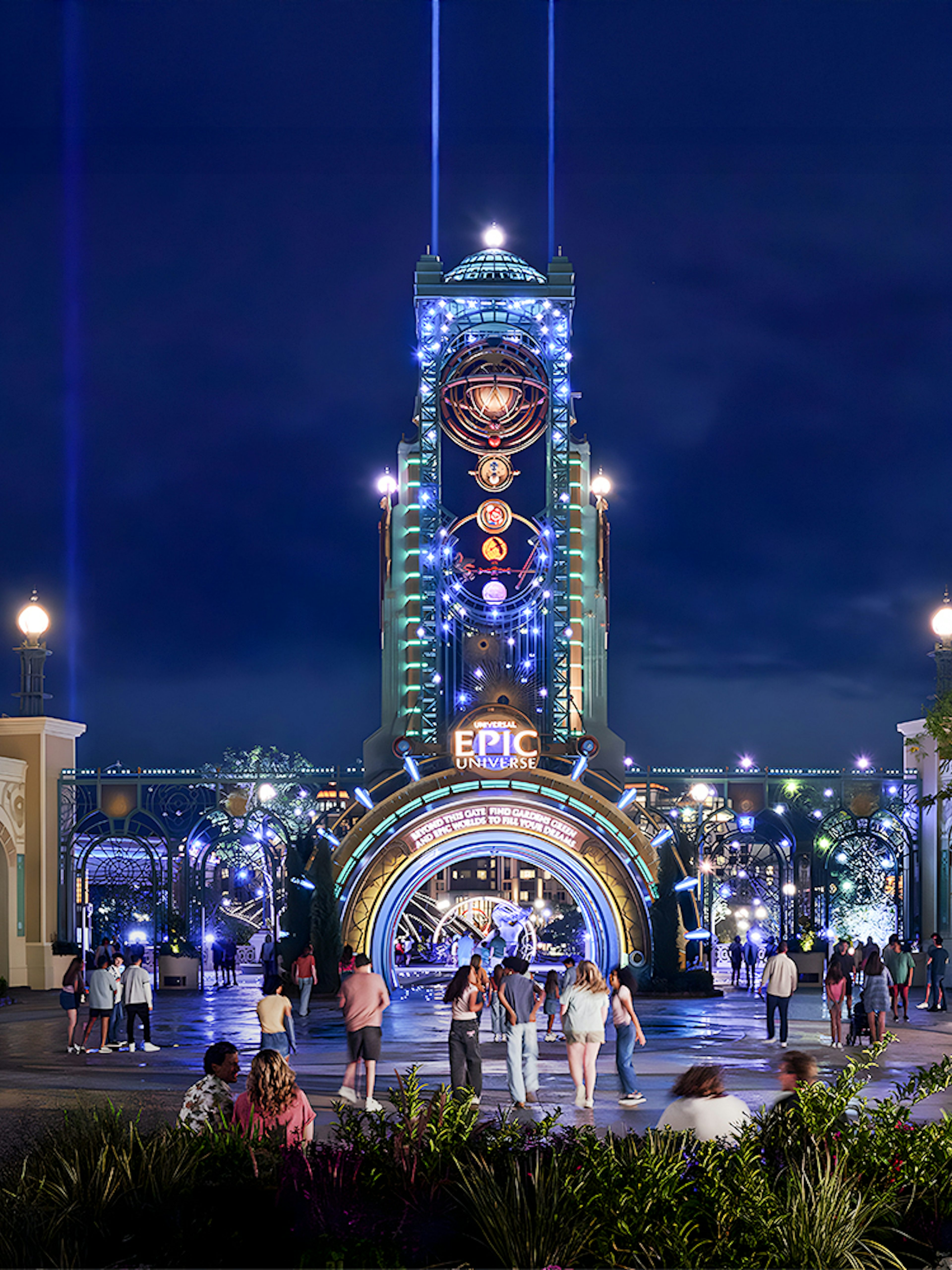 Guests entering Epic Universe park entrance at night, Universal Orlando, Florida.