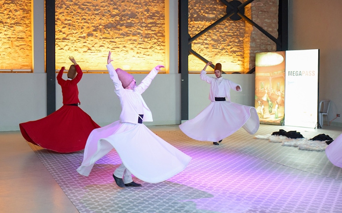 Whirling Dervishes performing traditional dance in Istanbul ceremony.