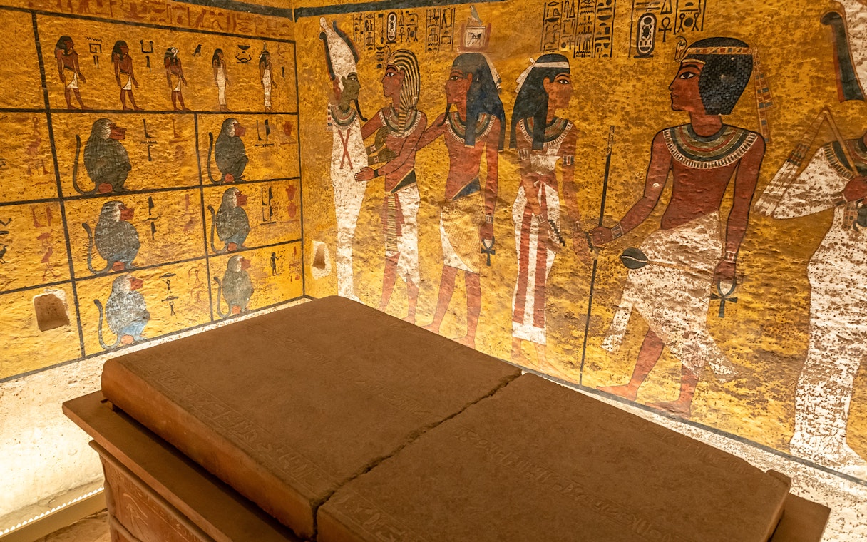 Tomb interior with ancient Egyptian wall paintings in the Valley of the Kings.