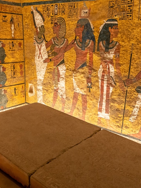 Tomb interior with ancient Egyptian wall paintings in the Valley of the Kings.