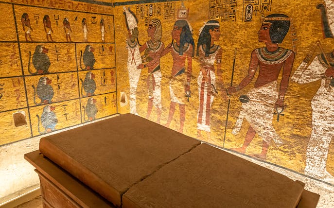 Tomb interior with ancient Egyptian wall paintings in the Valley of the Kings.