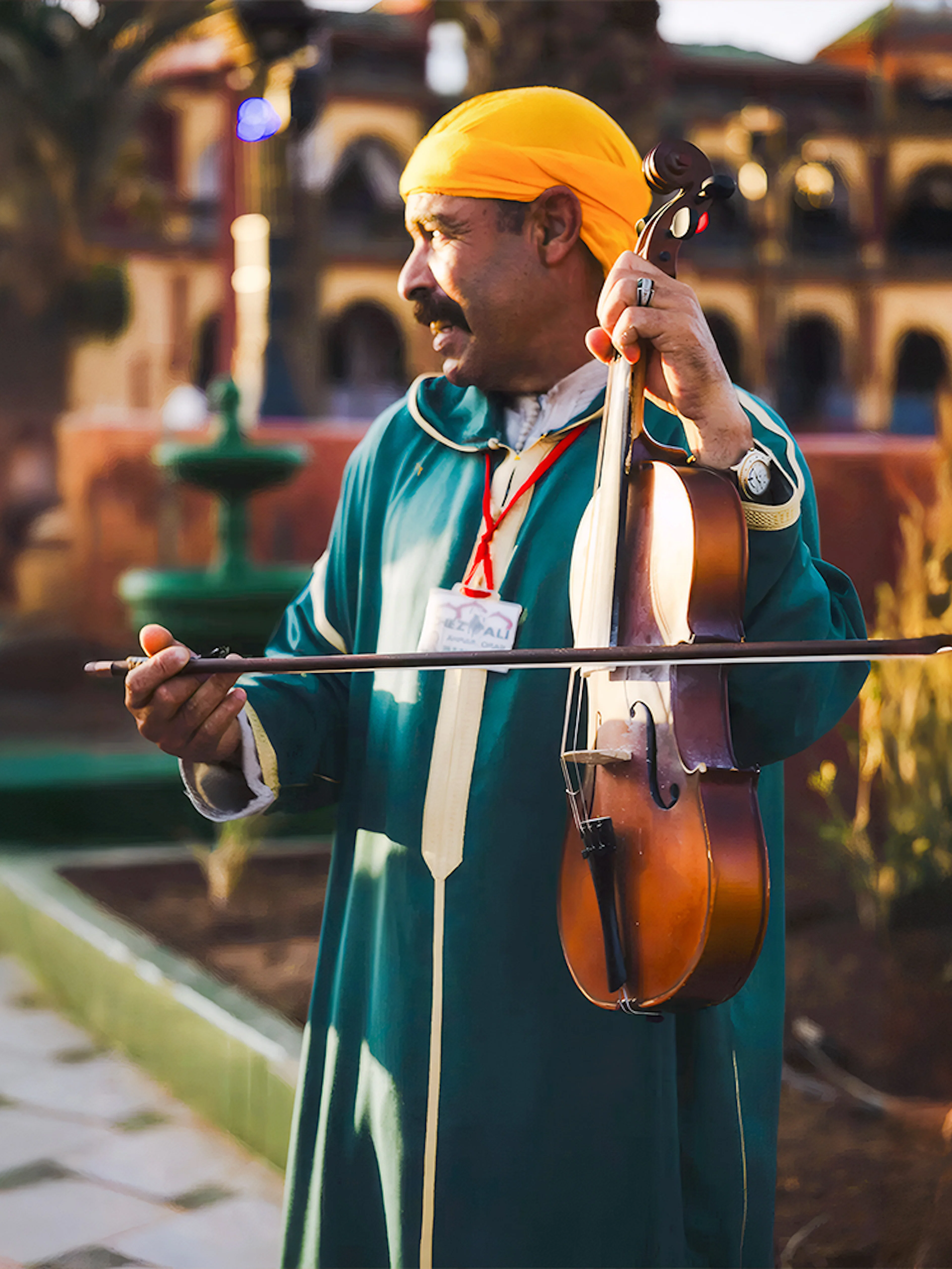 Musician playing violin at Chez Ali Dinner & Fantasia Show in Marrakech.
