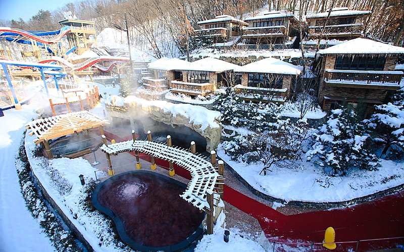 Snow-covered cottages and hot springs at Vivaldi Park Ski Resort.